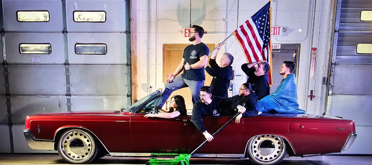 The Dantonio Auto team in a classic car